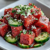 Vibrant, refreshing watermelon cucumber salad invigorates the palate with Tajin and lime.