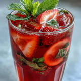 Sweet and tart hibiscus strawberry lemonade, a refreshing Juneteenth celebration favorite.