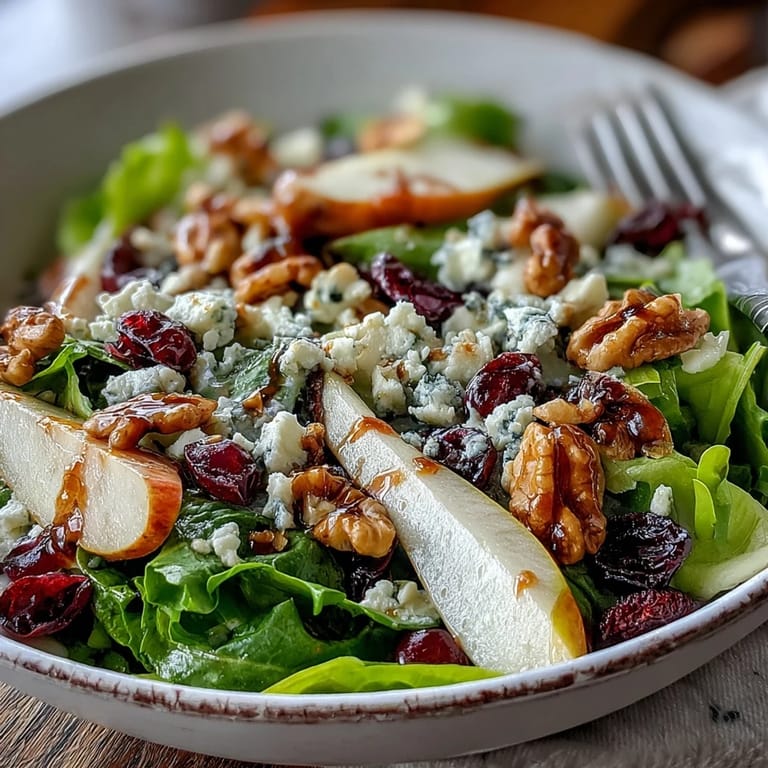 Drizzled with honey balsamic vinaigrette, this vibrant salad makes a refreshing vegetarian appetizer or light lunch for a party or dinner.