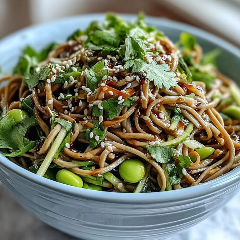 Chilled Soba Noodle Bowl topped with toasted sesame seeds and fresh cilantro, ready to enjoy for a healthy lunch or dinner.